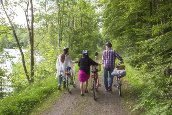 Family with bikes on the track